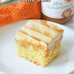 slice of butterscotch poke cake on a white plate