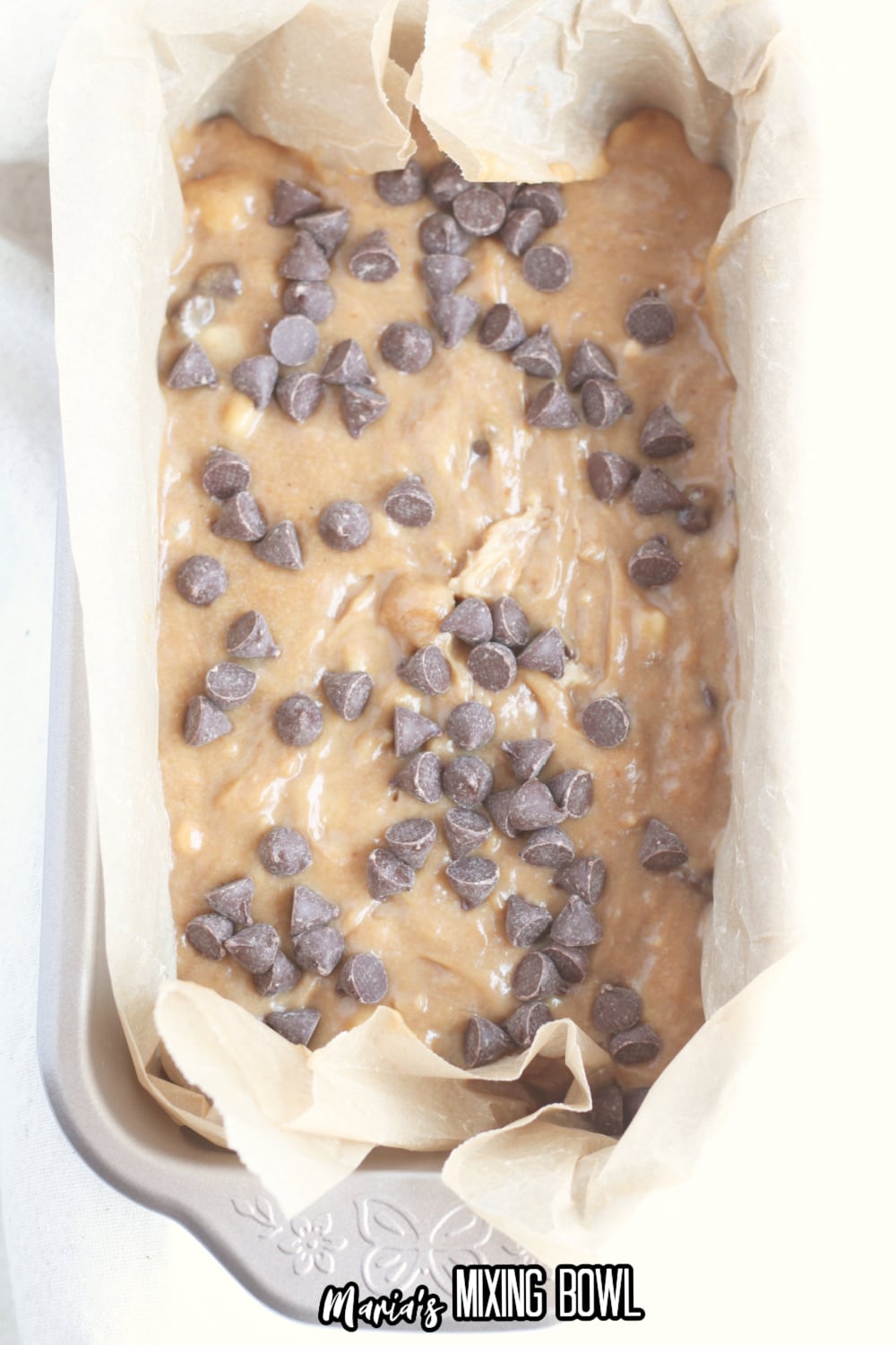 batter in a parchment lined loaf pan