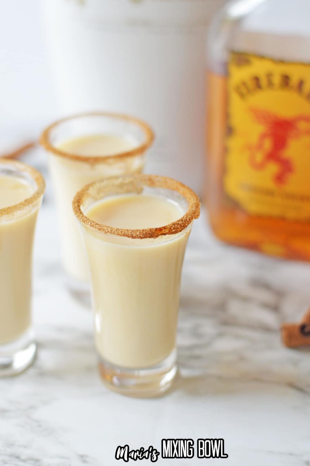 cinnamon toast crunch shot glasses on a marble countertop