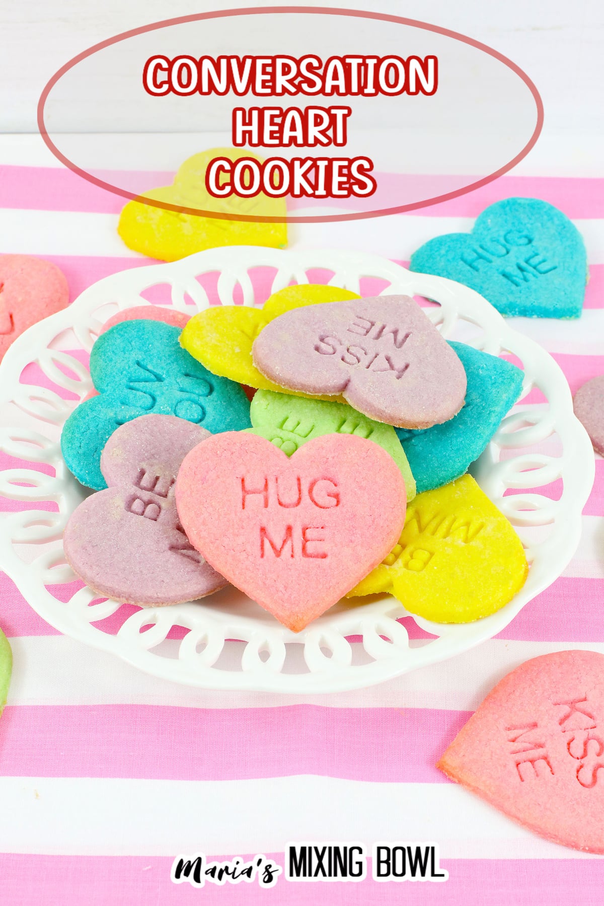 conversation heart cookies stacked on a white plate with the name in text for pinterest