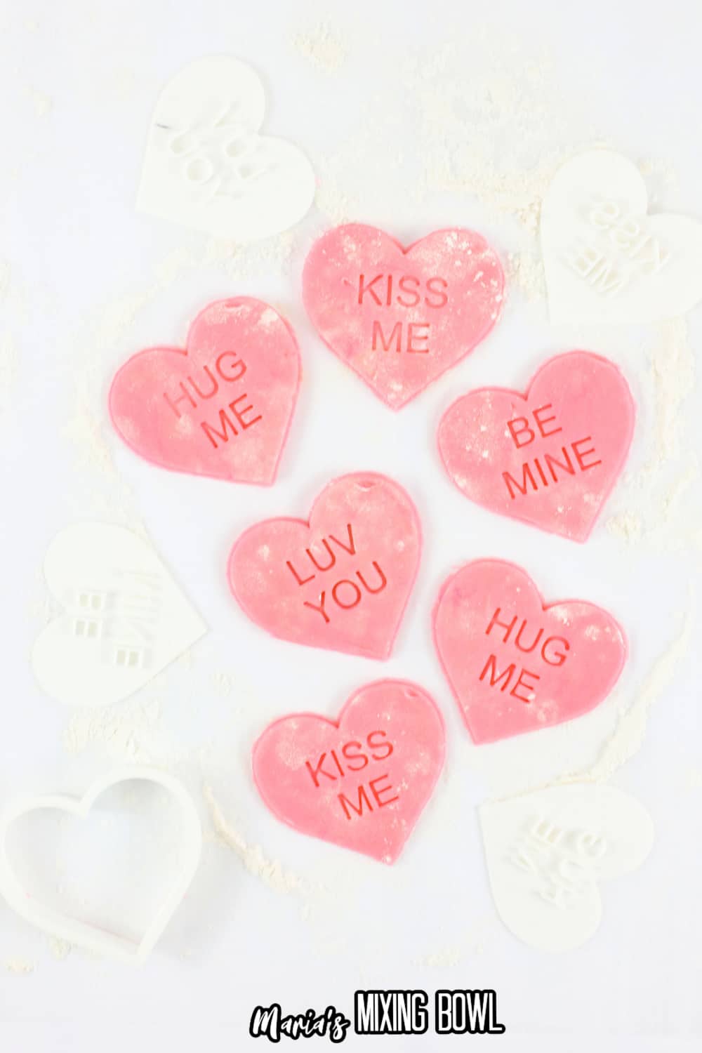 pink heart cookie dough stamped with words