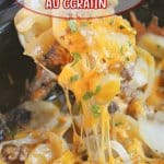 beef and potato au gratin on a spoon held above a crockpot full of it