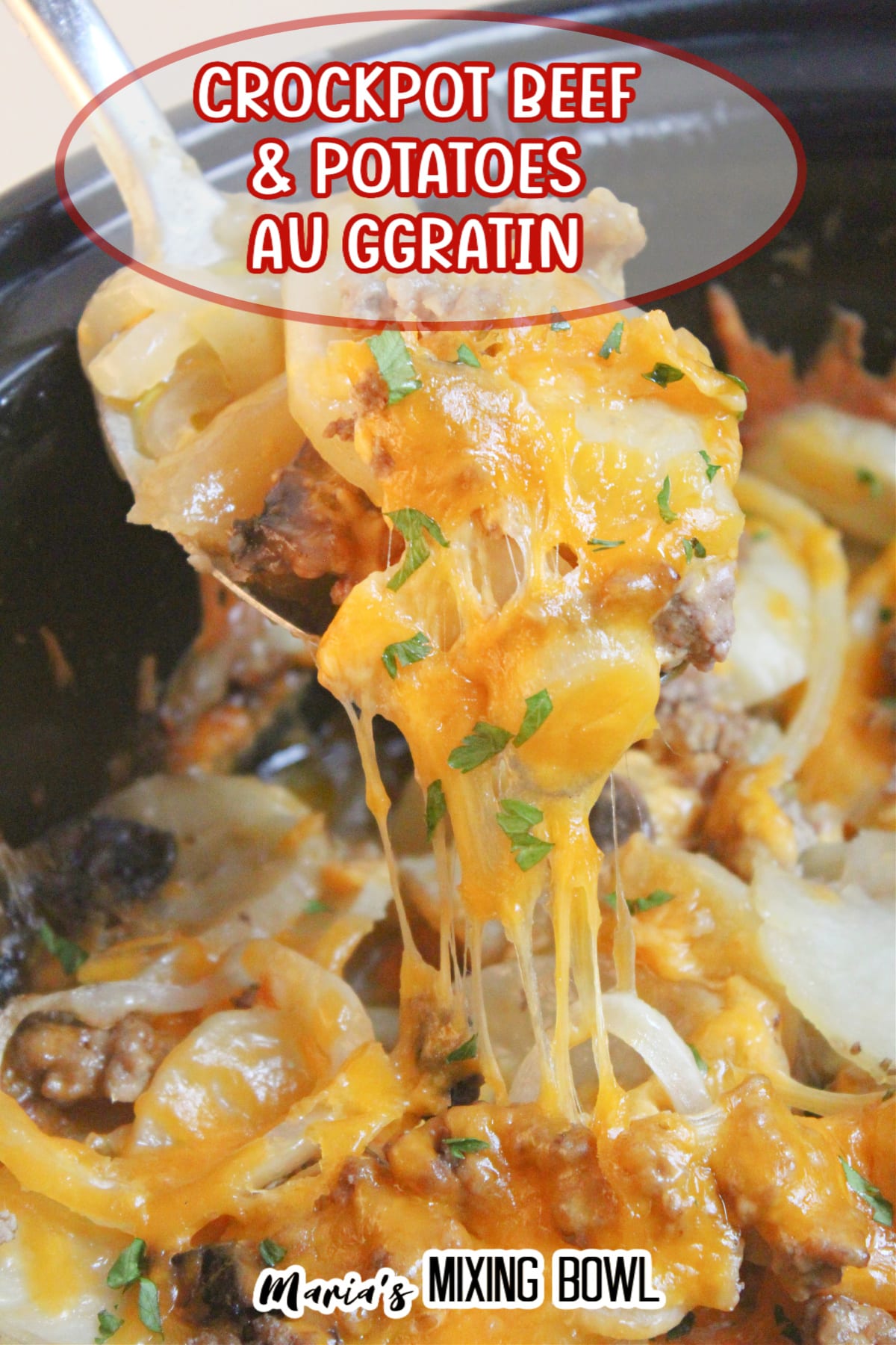 beef and potato au gratin on a spoon held above a crockpot full of it