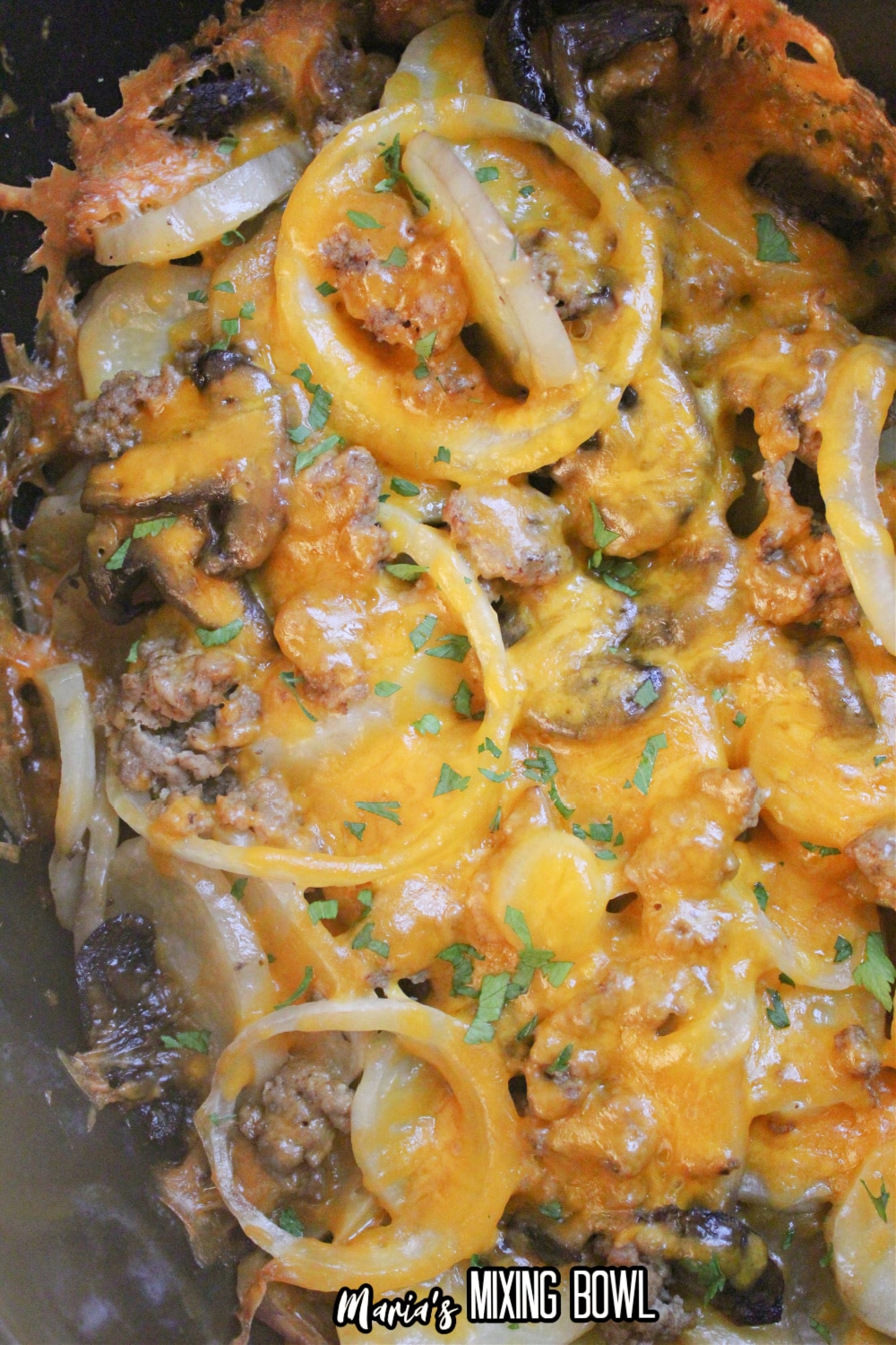 onions, mushrooms, cheese and potatoes in a slow cooker