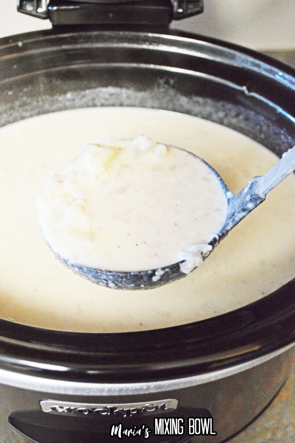 finished soup on a ladle in a crockpot