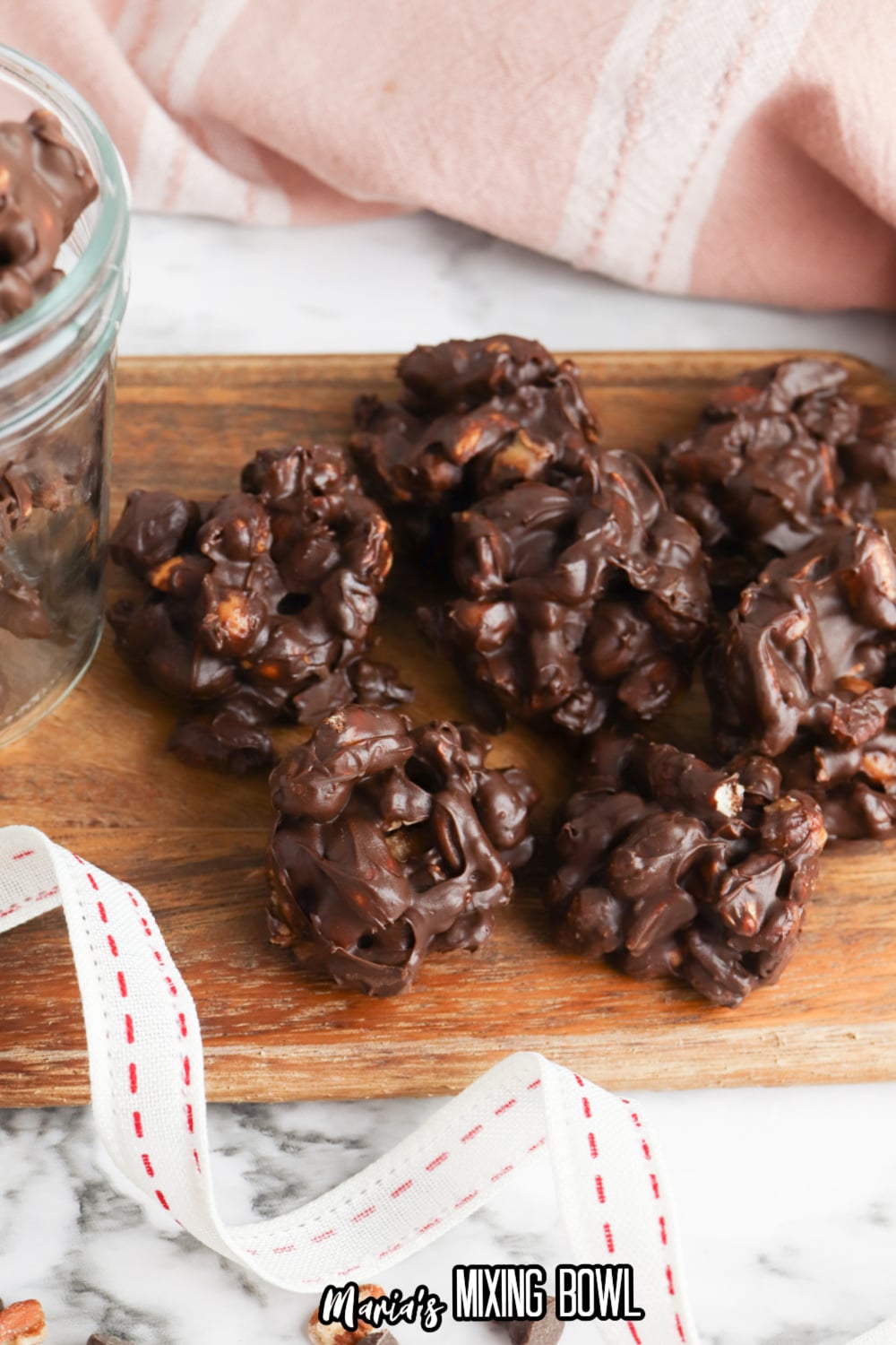 Crockpot Turtle Candy on a wooden cutting board