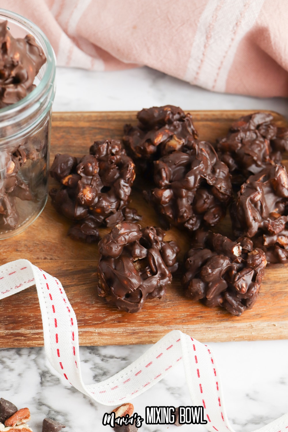 crockpot turtle candy on a wooden cutting board