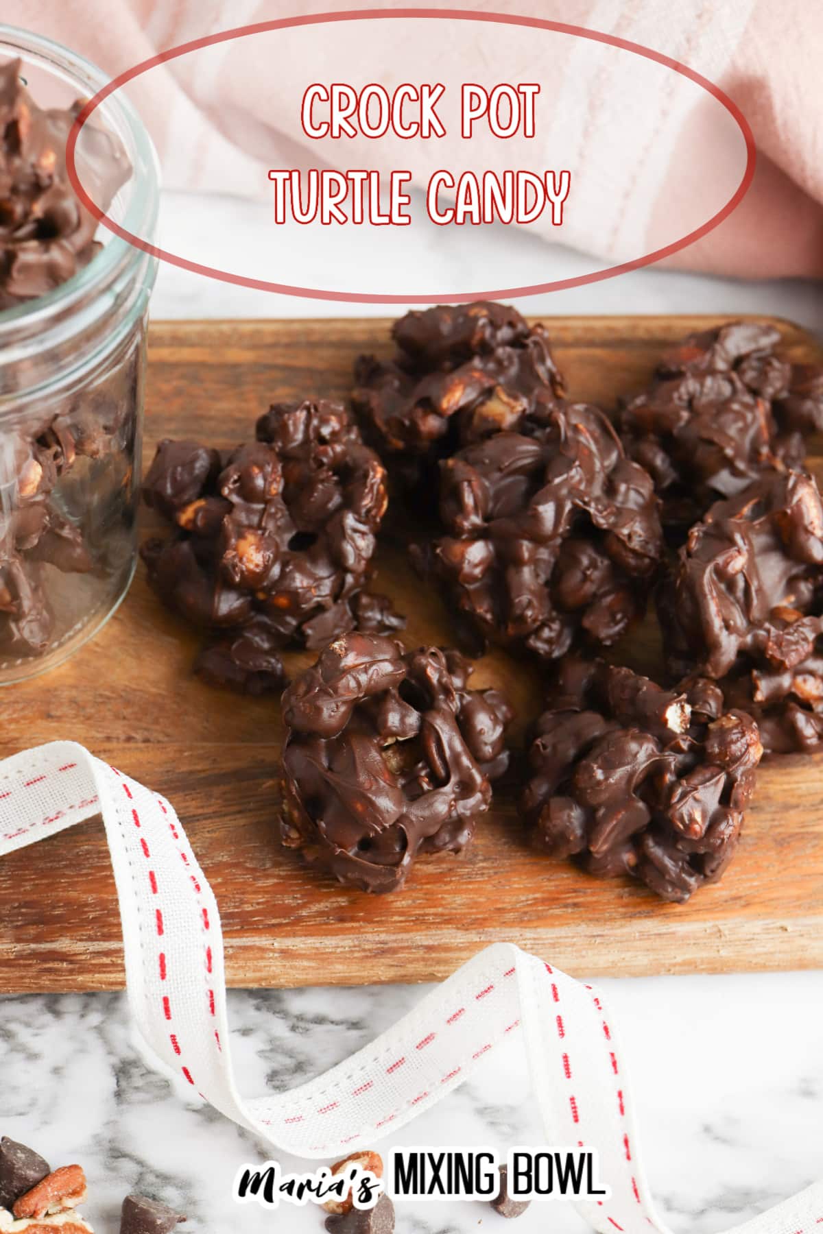 Crockpot Turtle Candy on a wooden cutting board with the name in text for pinterest