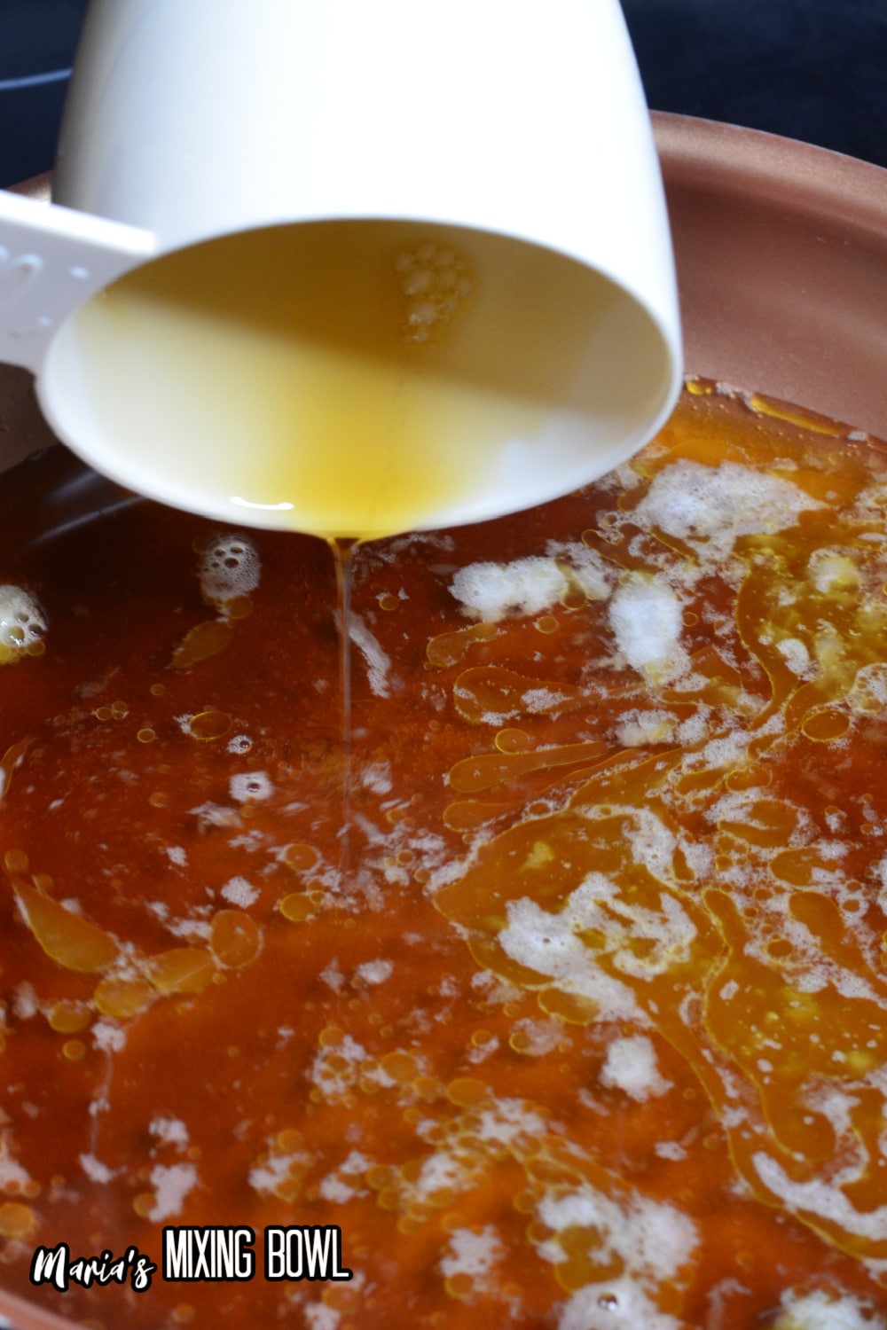 maple bourbon sauce being made in a saucepan
