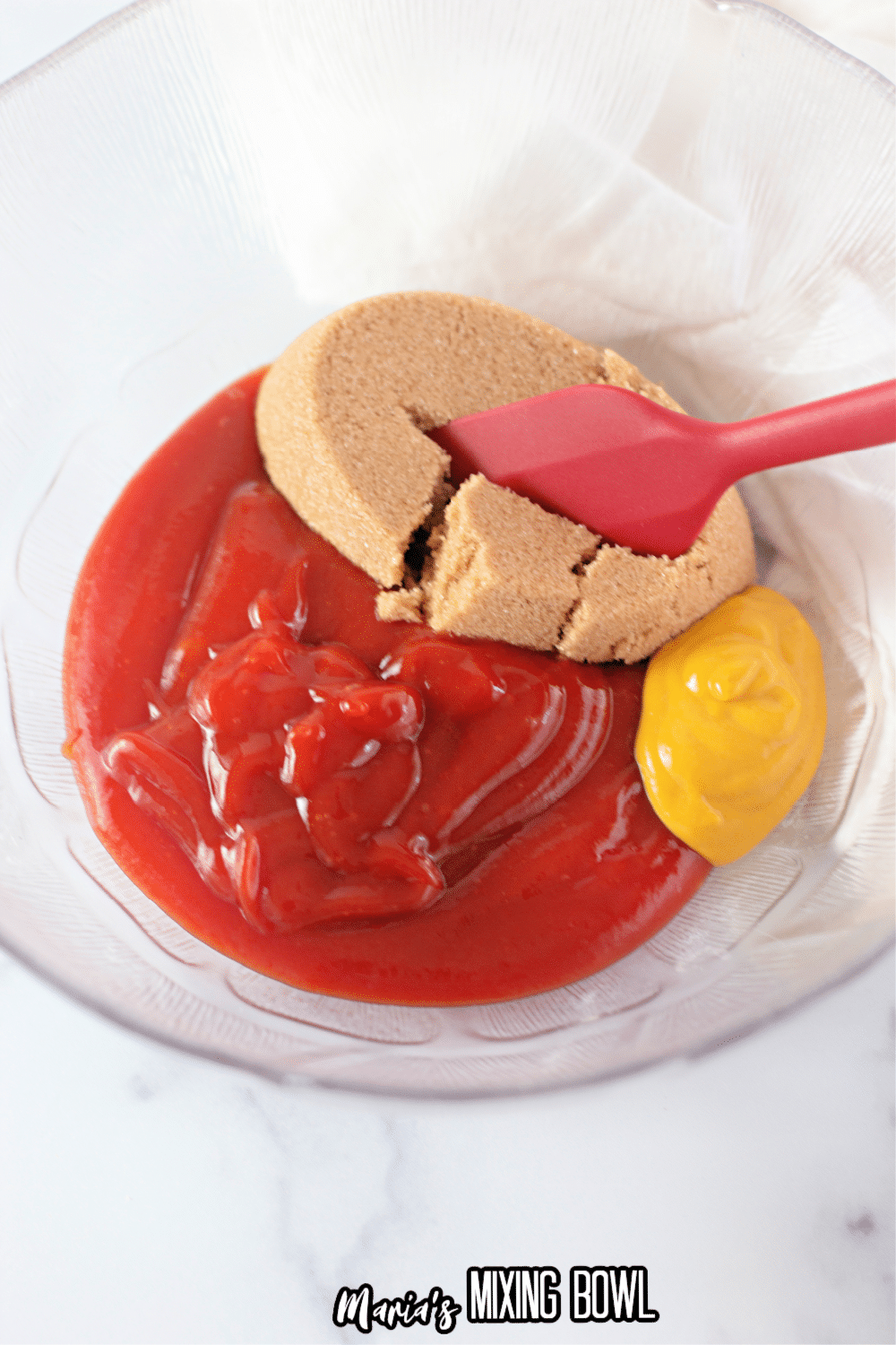 ketchup, brown sugar, and mustard in a small glass bowl