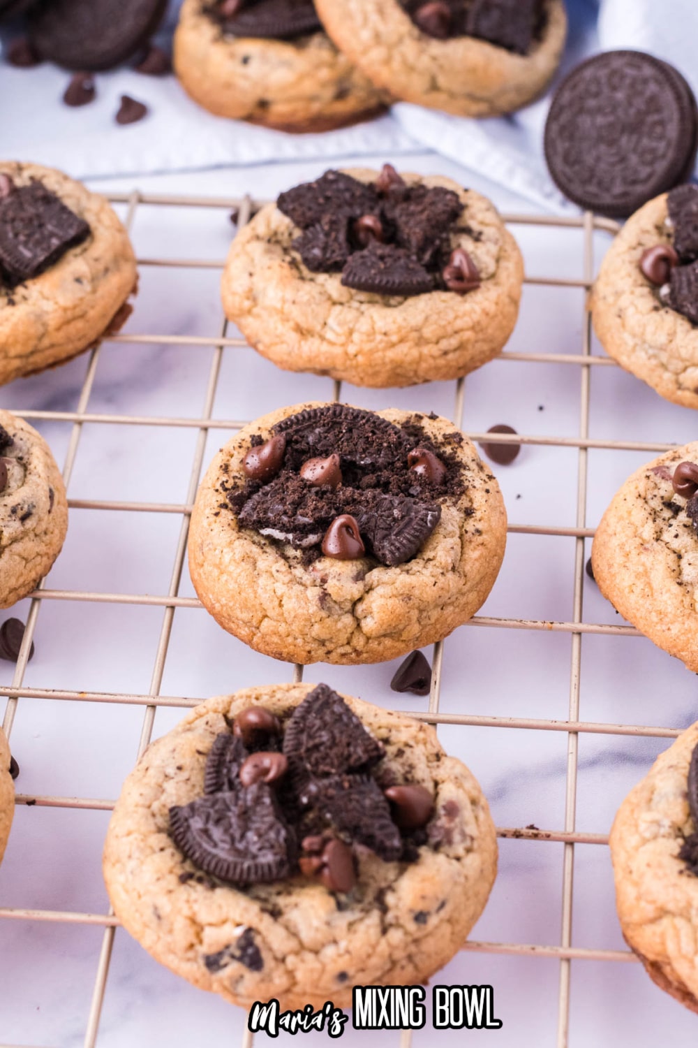 9 oreo chocolate chip cookies colling on a wire rack