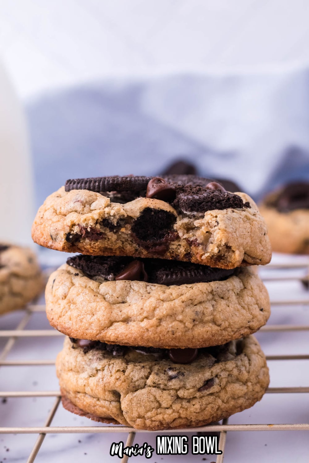 stack of oreo chocolate chip cookies with a bite missing from the top cookie
