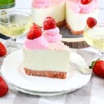 slice of strawberry champagne cheesecake on a white plate