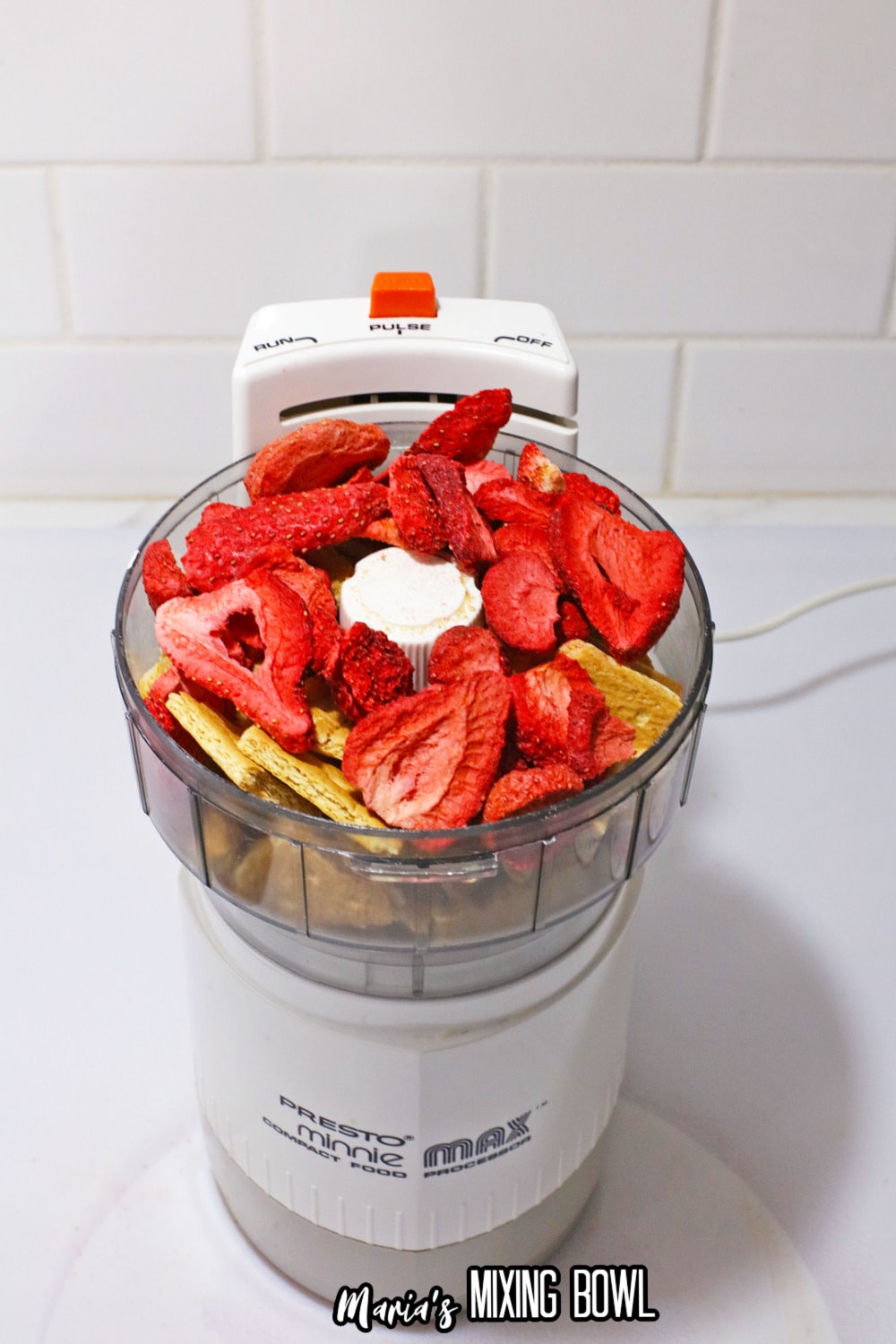 freeze dried strawberries and graham crackers in a food processor