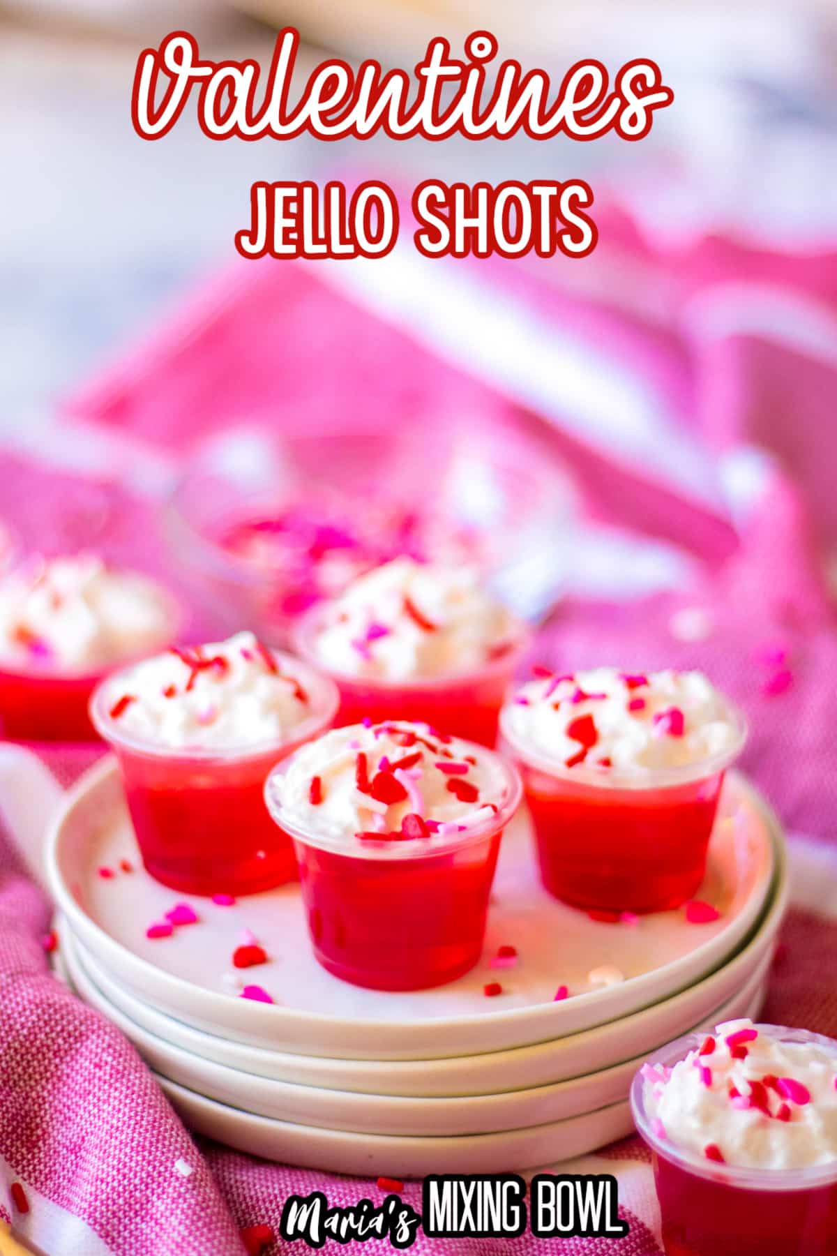 close up of a valentines day jello shots with the name in text for pinterest