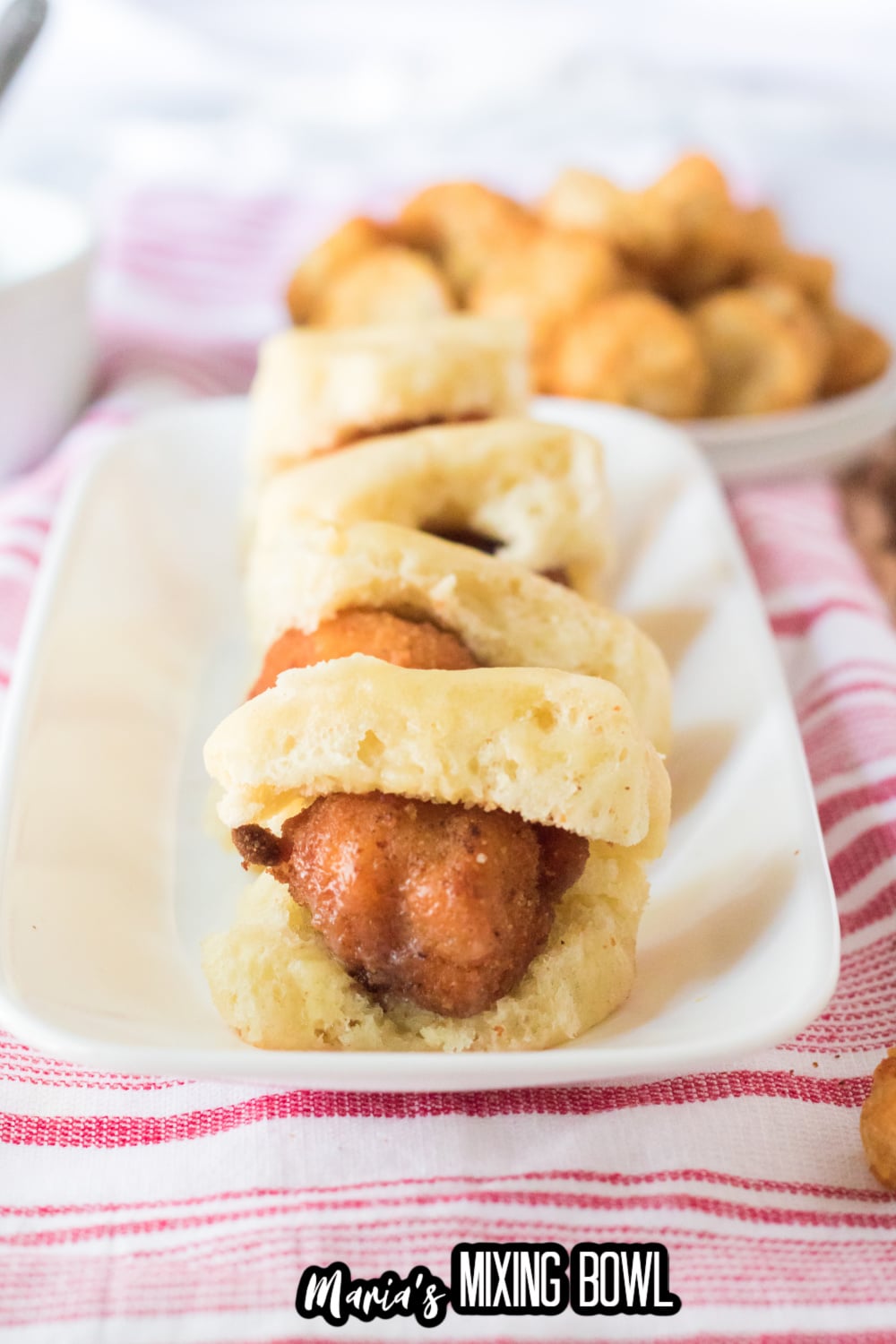 four chicken minis on a white platter