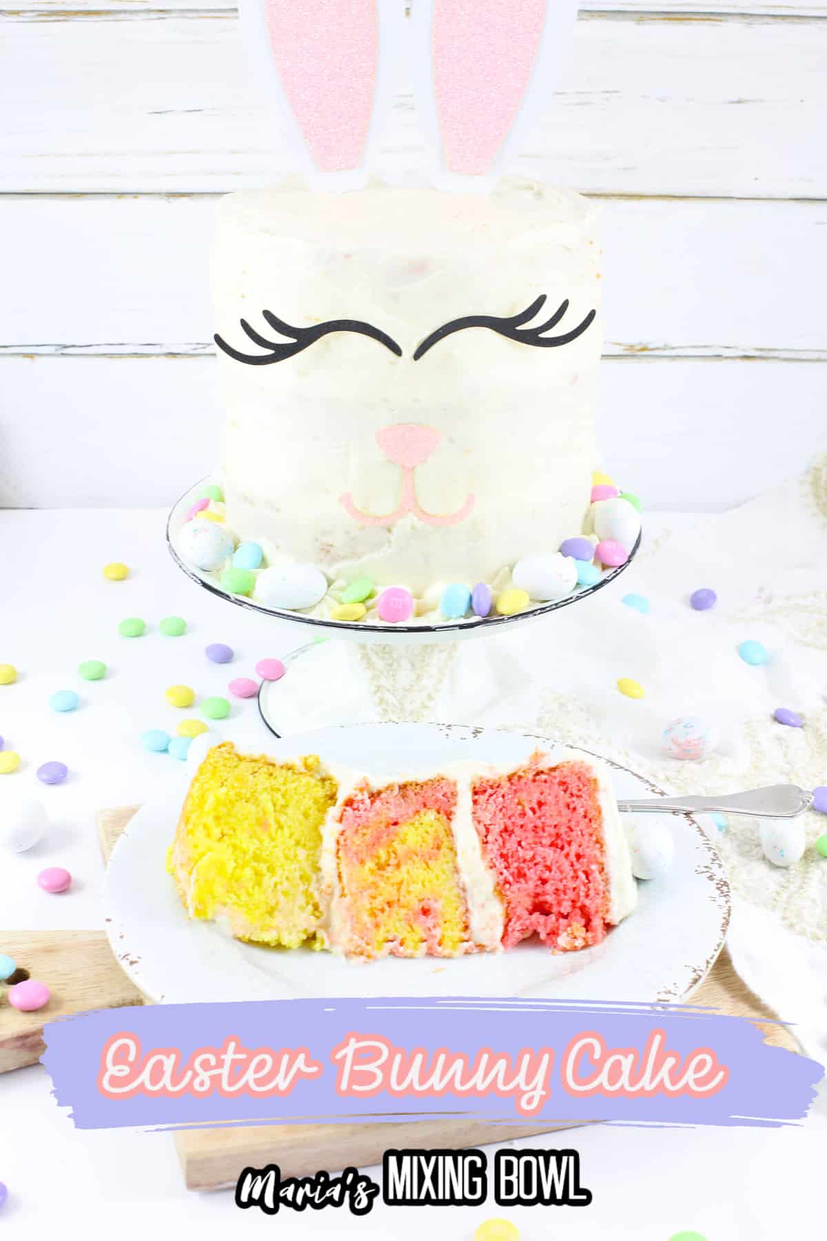 slice of bunny cake on a white plate with a full cake on a cake stand with the name in text for pinterest