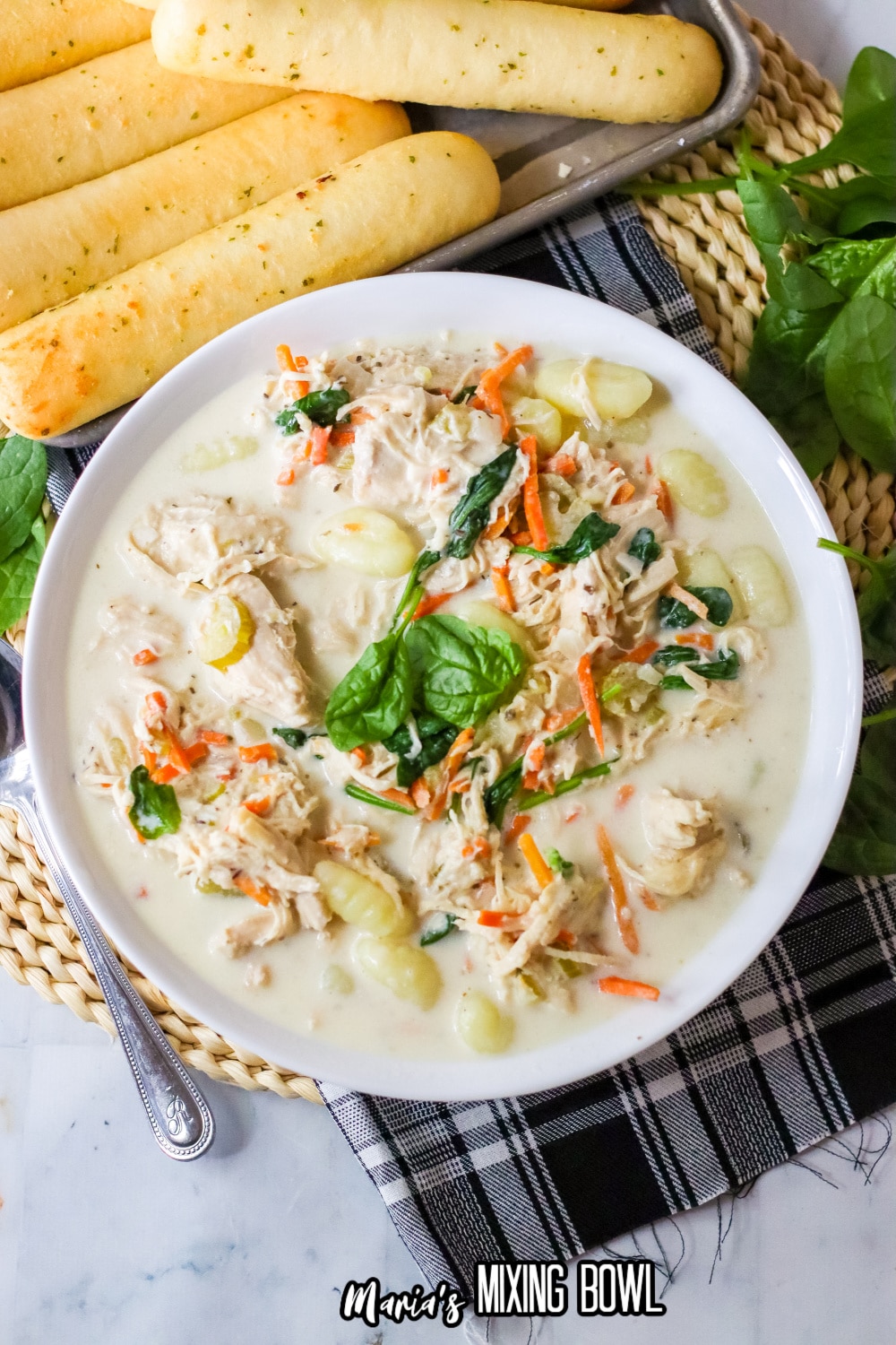 white bowl filled with slow cooker gnocchi soup