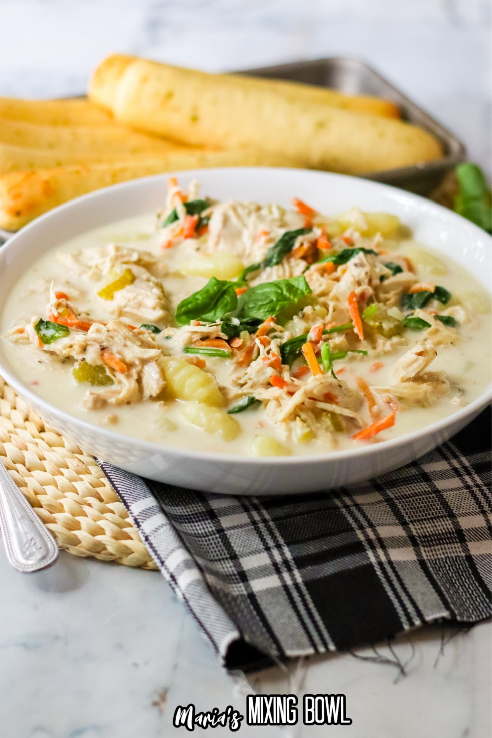 white bowl filled with slow cooker gnocchi soup