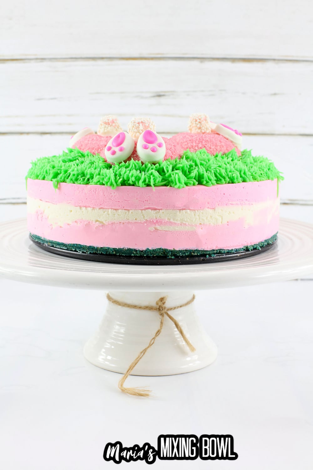 bunny butt cheesecake on a white cake stand