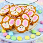 bunny pretzels stacked on a light blue plate with bunny pretzels in a text for pinterest