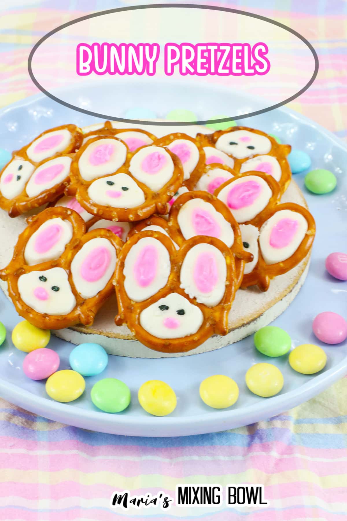bunny pretzels stacked on a light blue plate with bunny pretzels in a text for pinterest