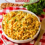 white bowl filled with cafeteria noodles and garnished with parsley with the name in text for pinterest