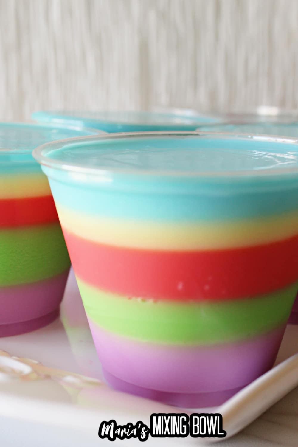 small plastic cups filled with colorful easter layered jello