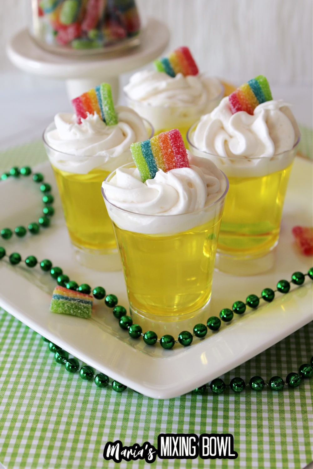 four lemon jello shots on a white plate