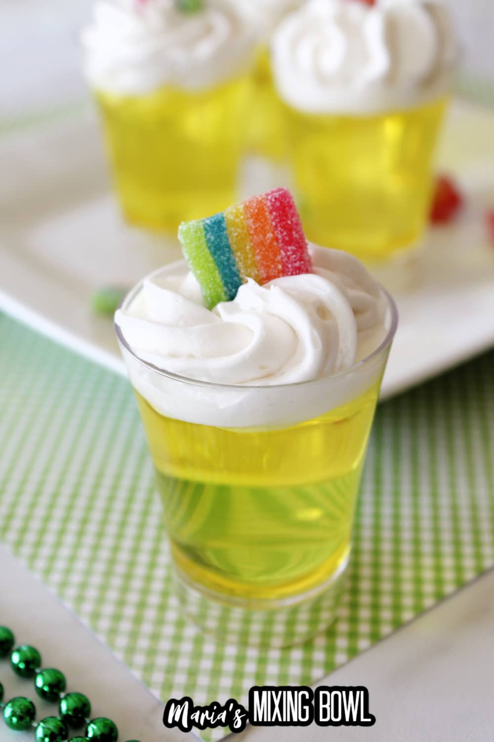 lemon jello shot on a green and white napkin