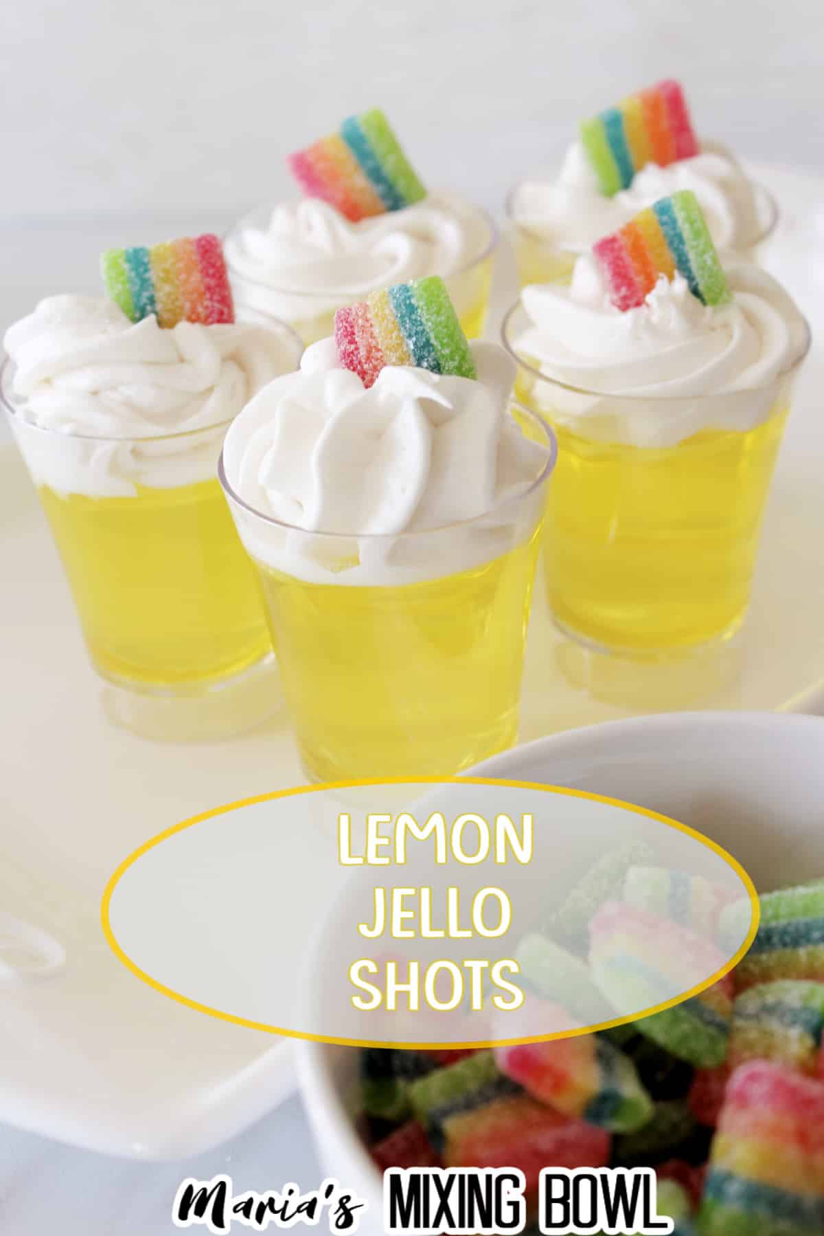 five lemon jello shots on a white platter with the name in text for pinterest