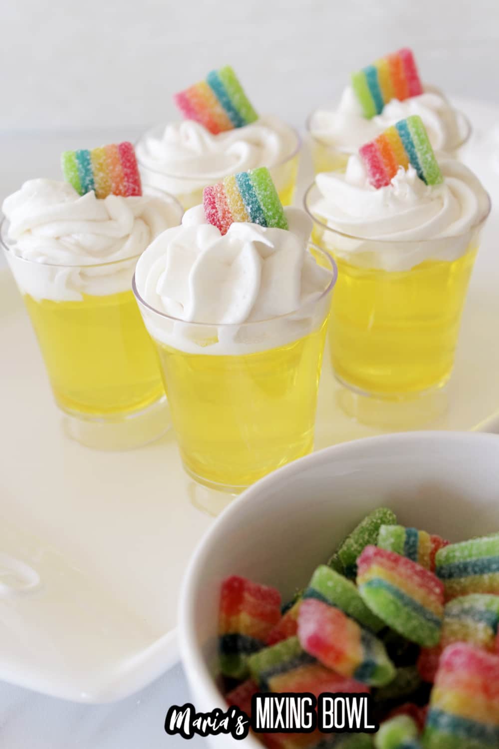 five lemon jello shots on a white platter