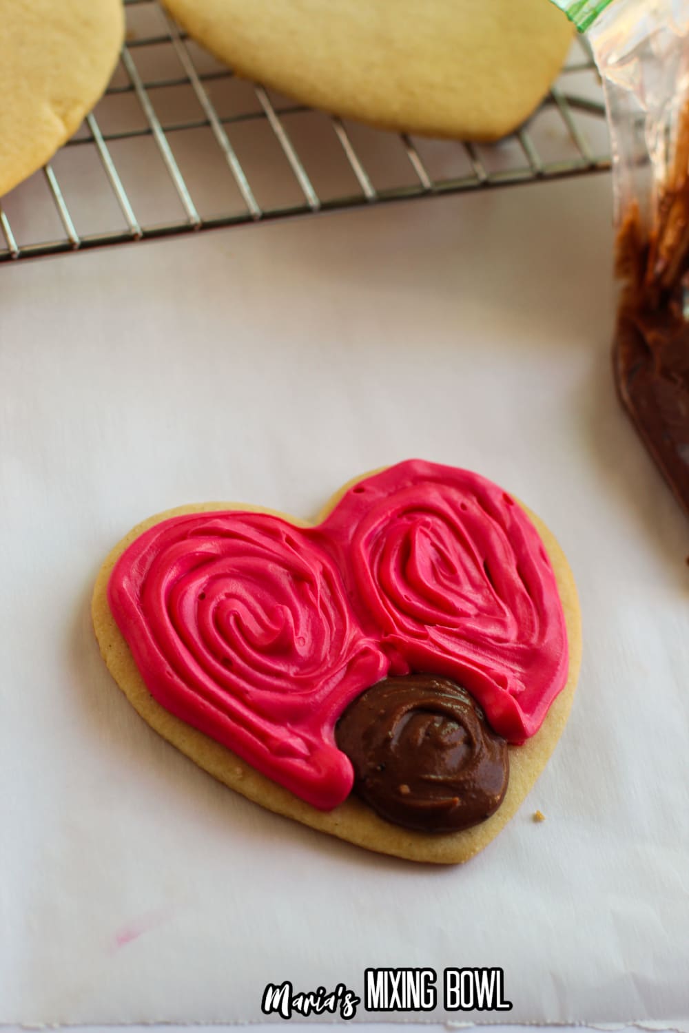 love bug cookie being frosted