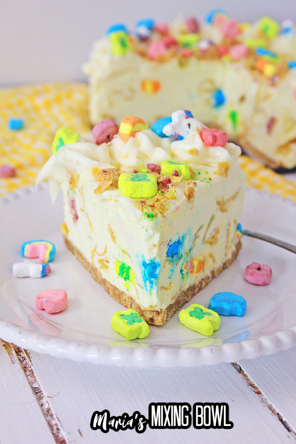 slice of lucky charms cheesecake on a white plate