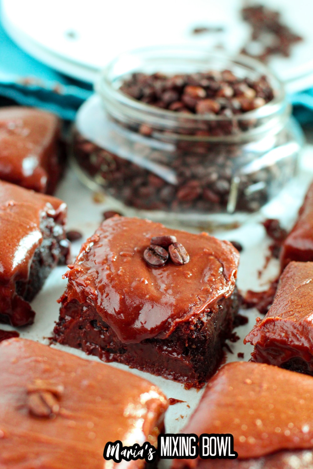 brownies in a row on a parchment lined baking sheet