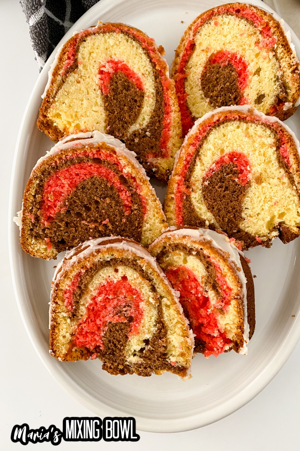 sliced of Neapolitan pound cake on a white platter