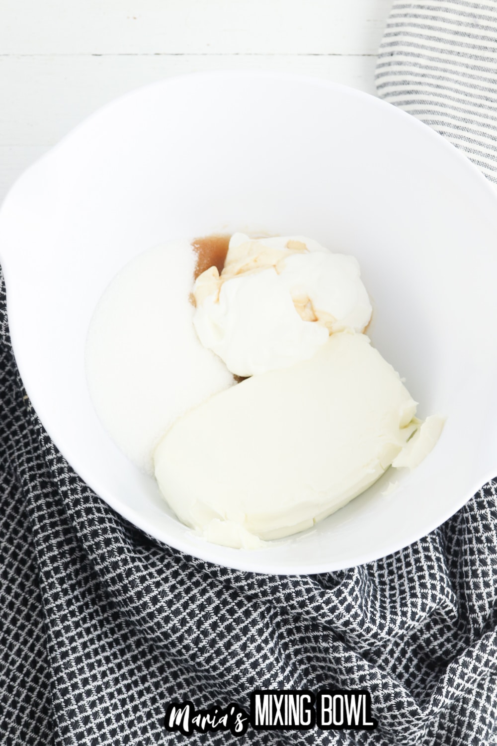 cream cheese and vanilla extract in a mixing bowl