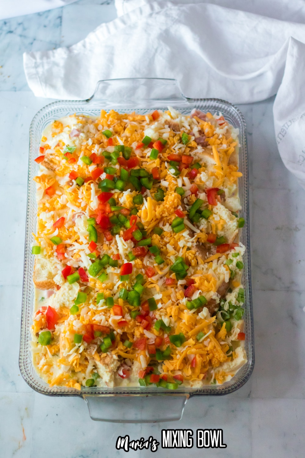 ingredients layered in a glass baking dish ready for the fridge.