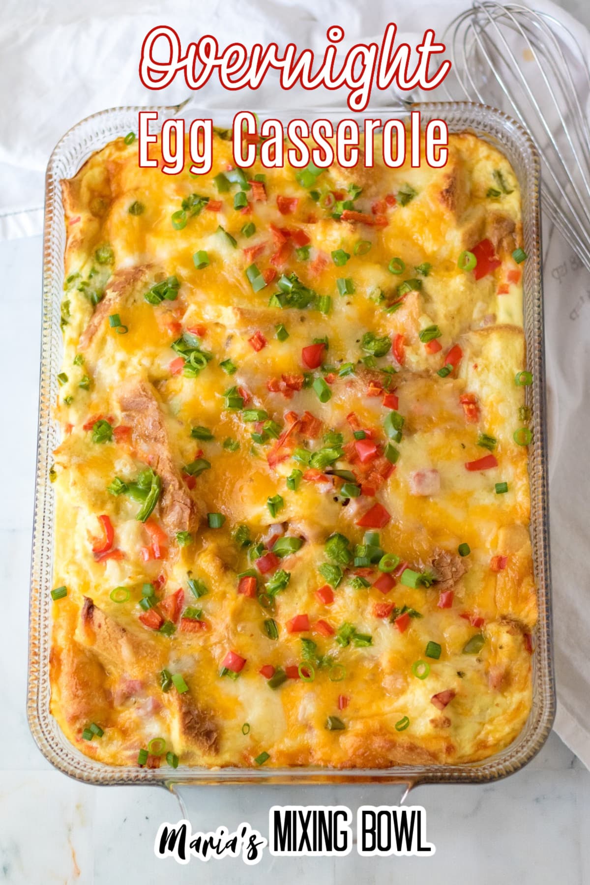 overnight egg casserole in a glass baking dish with the name in text for pinterest