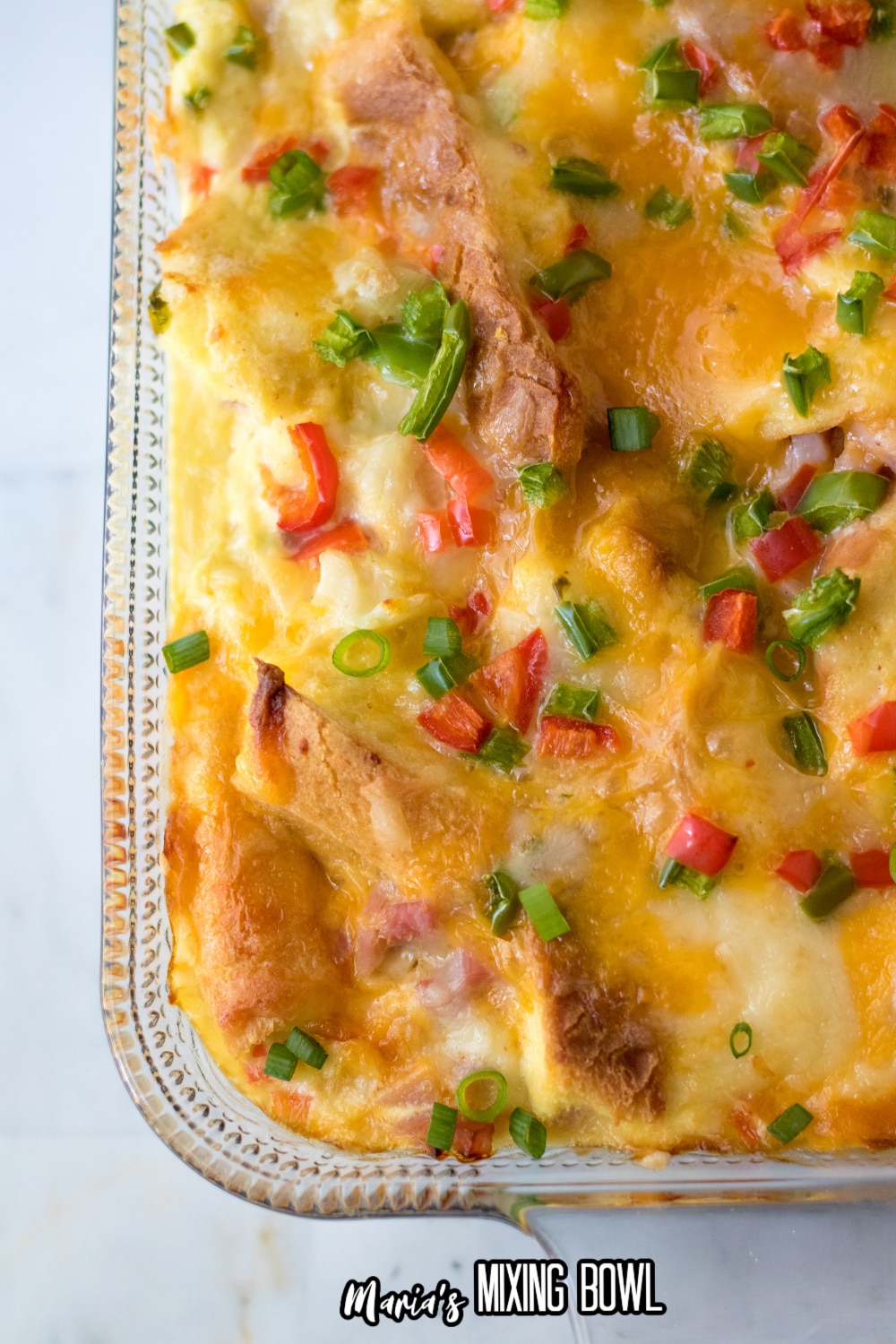off center image of a overnight egg casserole in a glass baking dish