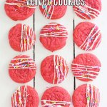 three rows of pink velvet cookies on a wooden background with the name in text for pinterest