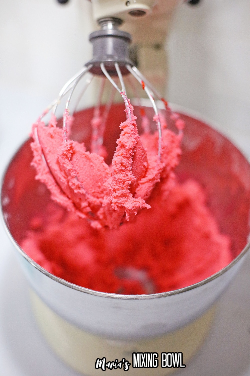pink cookie dough in a stand mixer