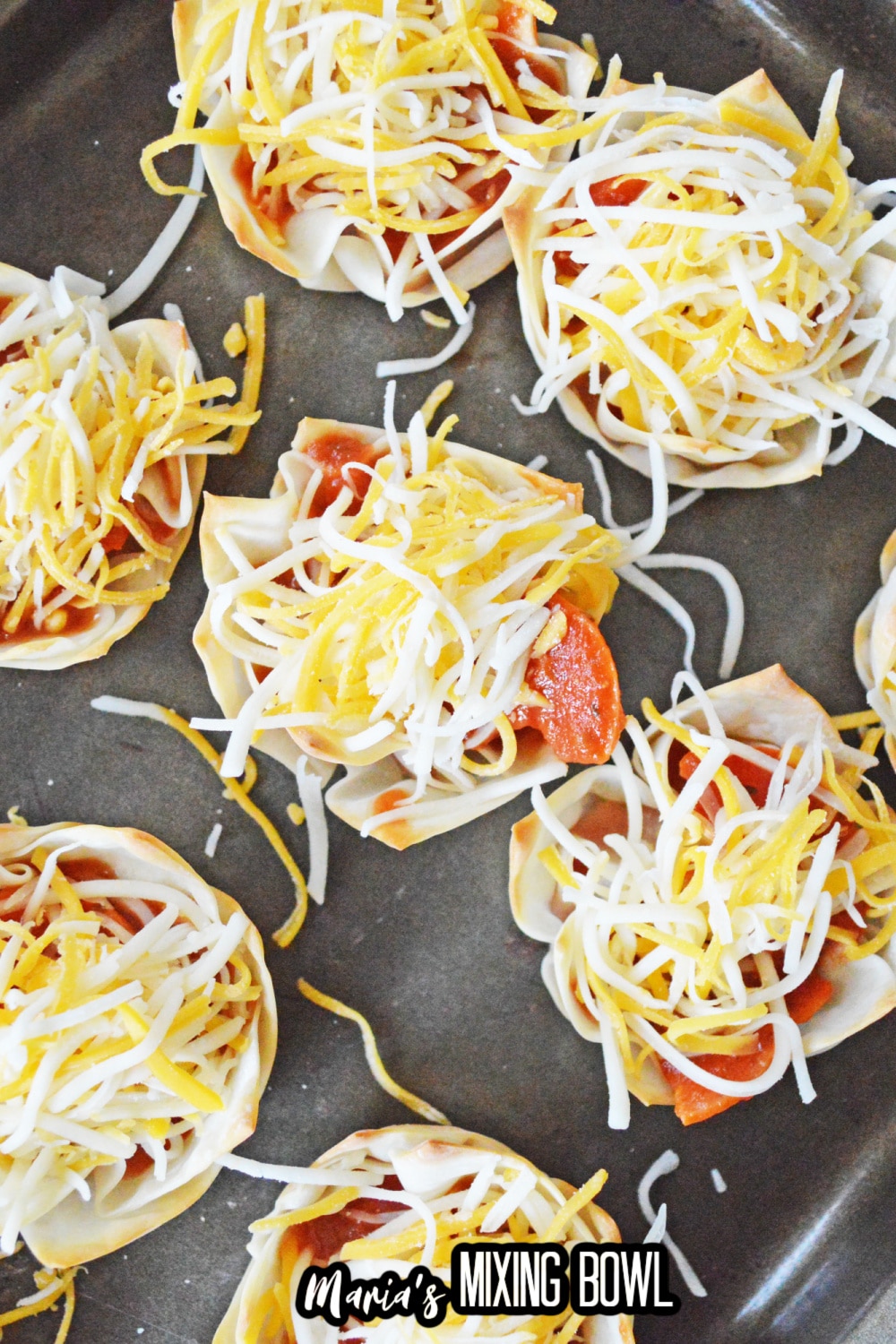 filled wonton cups on a baking sheet