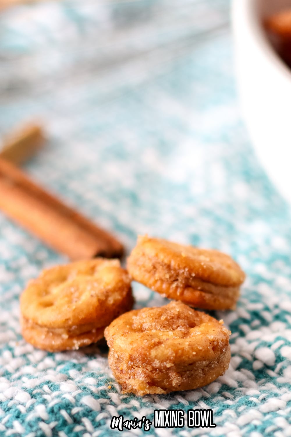 close up of three ritz bitz churros on a teal and white napkins