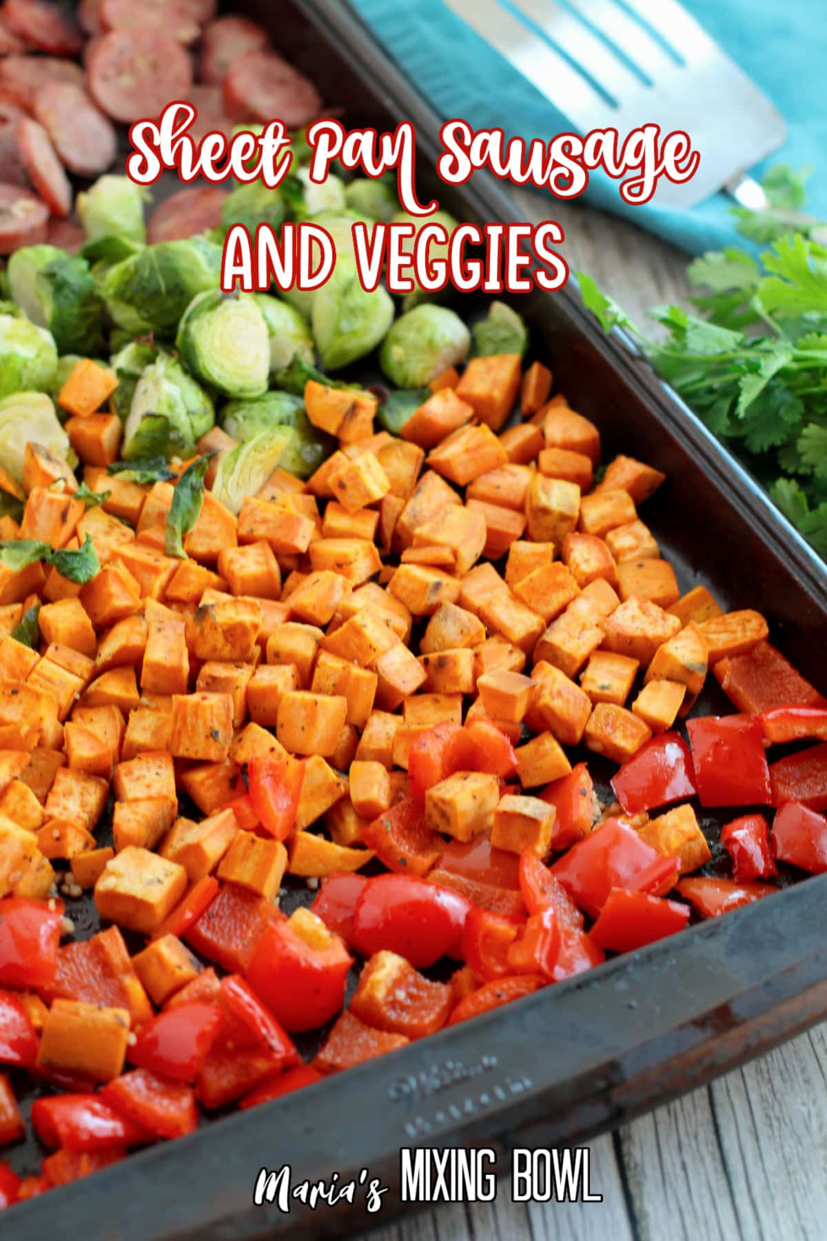 sausage, brussel sprouts, sweet potatoes and peppers on a sheet pan with the name in text for pinterst