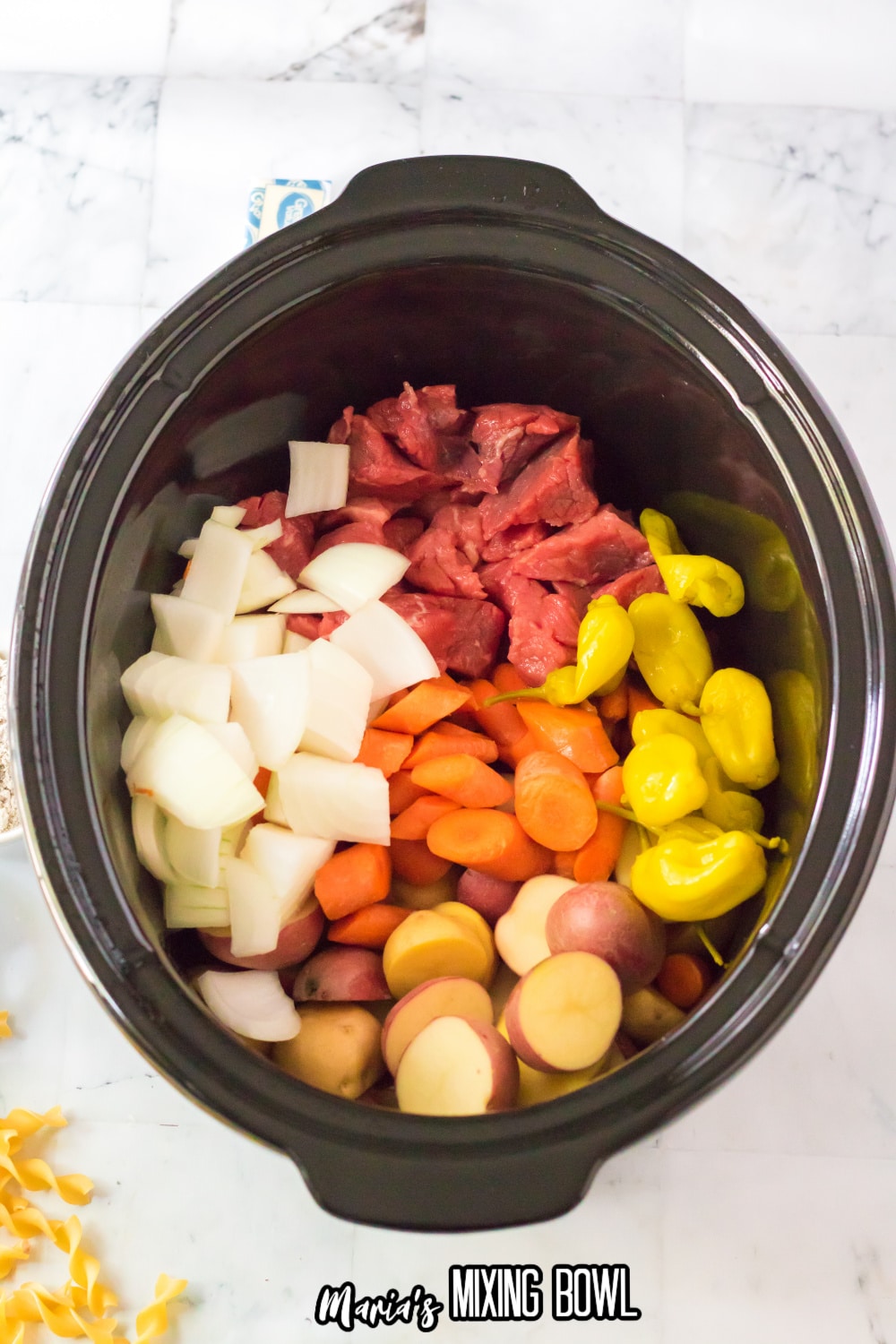 meat, and vegetables in a crock pot liner