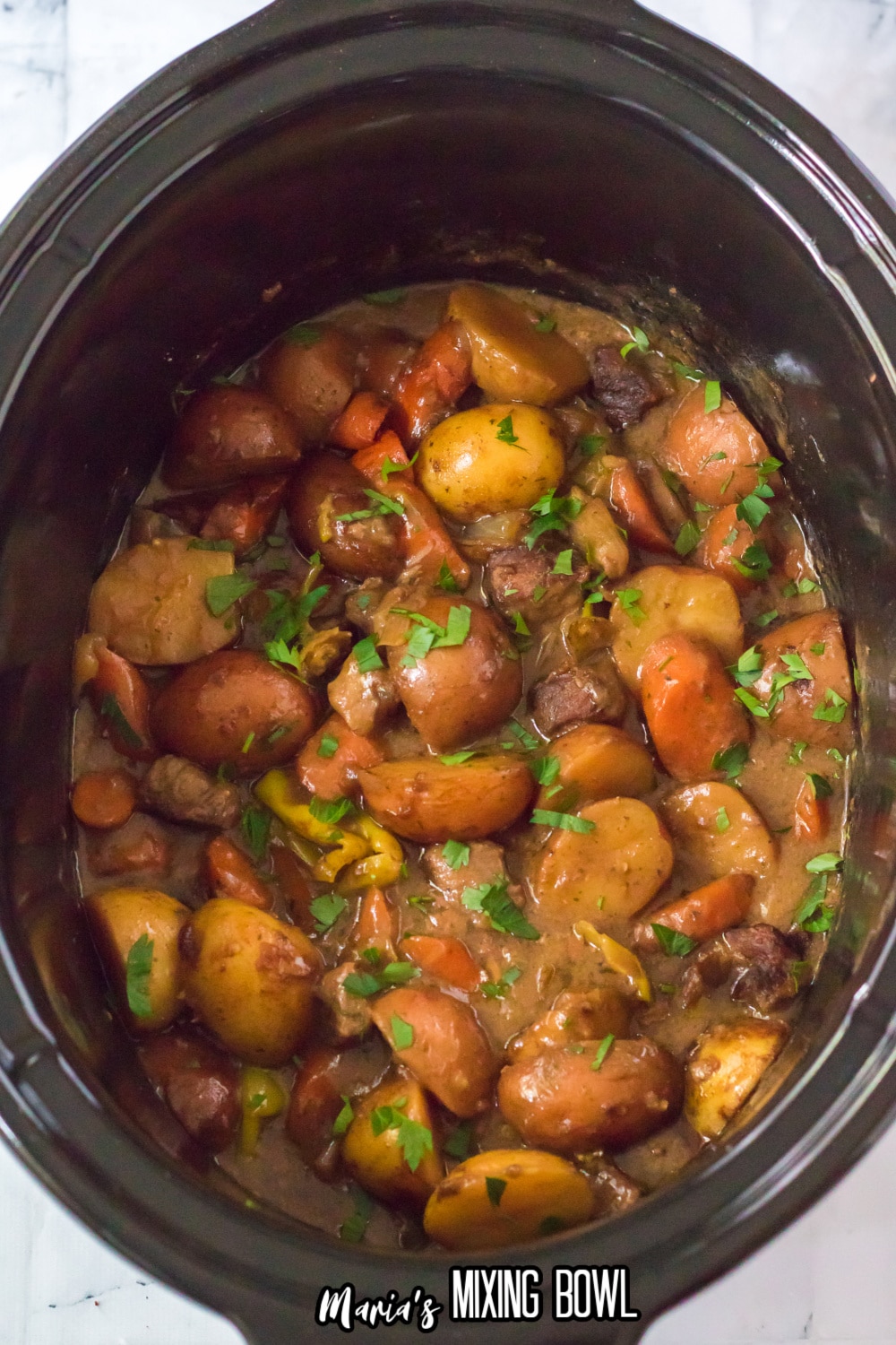 cooked roast in a slow cooker liner