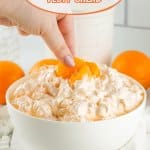 white bowl filled with orange fluff with the name in text for pinterest