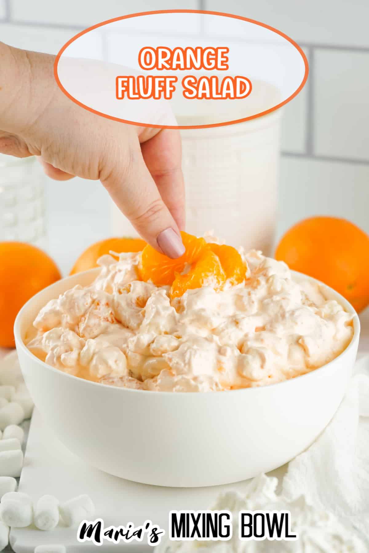 white bowl filled with orange fluff with the name in text for pinterest