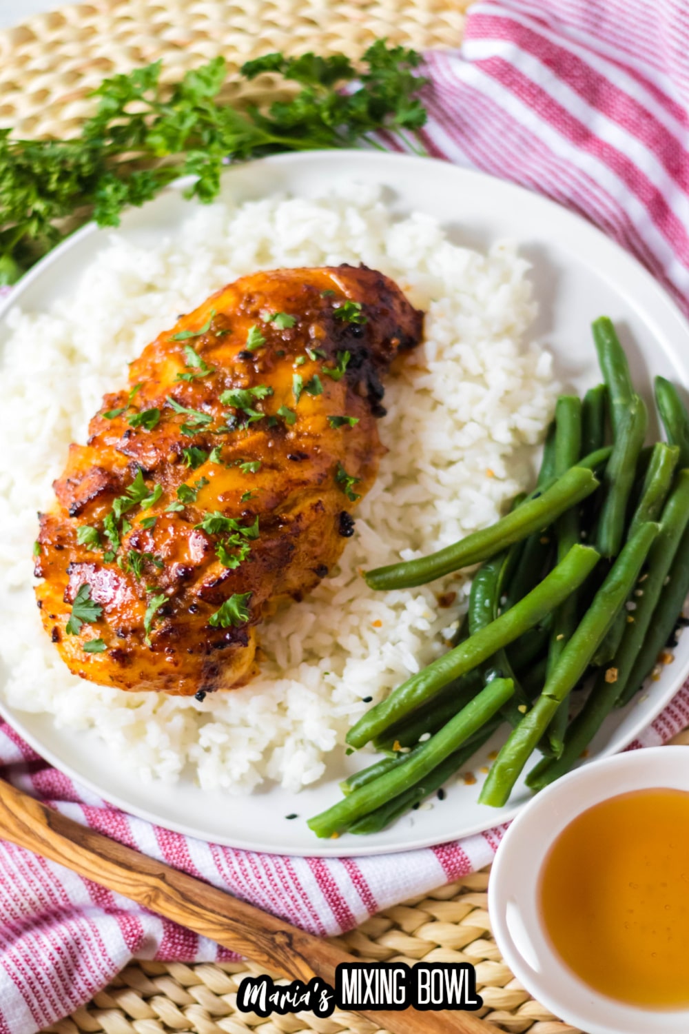 air fryer hot honey chicken breast on top of a bed of rice